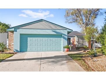 Charming single-story home featuring a two-car garage and well-maintained front yard at 17 Hibiscus Ct, Eustis, FL 32726