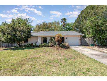 Charming home with a well-maintained front yard and inviting curb appeal on a sunny day at 6 Winding Ridge Rd, Casselberry, FL 32707