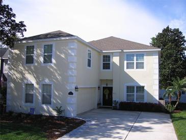 Charming two-story home with a well-manicured lawn, inviting entrance, and plenty of parking at 506 Freeman St, Longwood, FL 32750