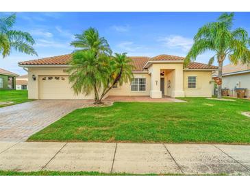Charming single-story home with lush green lawn and well-maintained landscaping at 3403 Great Pond Dr, Kissimmee, FL 34746