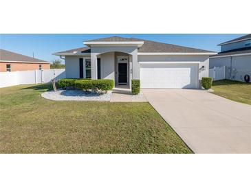 Charming single-Gathering home featuring a well-manicured lawn at 13233 Lake Yale View Loop, Grand Island, FL 32735