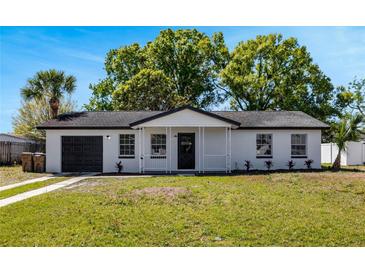 Charming single-story home with a well-maintained lawn, front porch, and a one-car garage at 188 Citrus Dr, Kissimmee, FL 34743