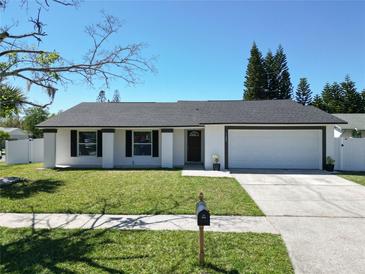 Charming single-story home featuring a well-manicured lawn and a classic mailbox, perfect for suburban living at 11364 Cardiff Dr, Orlando, FL 32837