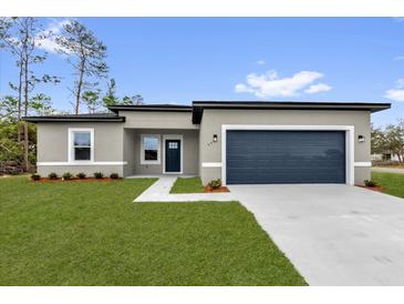 Charming single-story home featuring a well-maintained lawn and a two-car garage at 531 Marion Oaks Blvd, Ocala, FL 34473