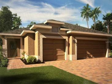 Beautiful home exterior featuring a two-car garage, stucco finish, and meticulously maintained landscaping at 179 Blue Cypress Dr, Davenport, FL 33837