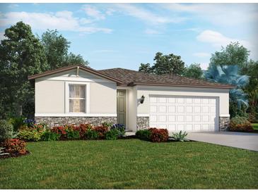 Charming one-story home with stone accents, a two car garage, and lush landscaping at 2105 Rosewood Dr, Bartow, FL 33830