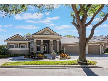 Stunning single-story home boasting an elegant exterior, manicured landscaping and a paver driveway at 703 Cricklewood Ter, Lake Mary, FL 32746