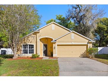 Inviting single-Gathering home with a well manicured lawn and two car garage at 4424 Park Eden Cir, Orlando, FL 32810
