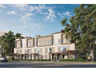 Modern townhomes with neutral exteriors, landscaping, and a sidewalk for pedestrians to enjoy at 1002 E Robinson St # 1, Orlando, FL 32801