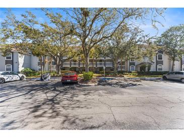 Charming condo complex with mature trees and ample parking in a convenient location at 14013 Fairway Island Dr # 434, Orlando, FL 32837