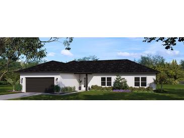 Charming single-story home with lush landscaping and a welcoming two-car garage in a serene setting at 13010 Hazelnut Ln, Astatula, FL 34705