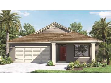 Charming single-Gathering home featuring a two-car garage and a well-manicured lawn with tropical landscaping at 491 Taylor Groves Dr, Lake Wales, FL 33898