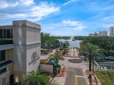 Beautiful view of Lake Eola from the Metropolitan building featuring palm trees and a fountain at 151 E Washington St # 419, Orlando, FL 32801