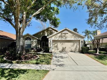 Charming single-Gathering home with well-manicured lawn and mature trees in a quiet neighborhood at 634 Manderley Run, Lake Mary, FL 32746