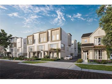 Stunning townhome showcasing modern architectural design, beautiful landscaping, and inviting outdoor spaces at 1004 E Robinson St # 1, Orlando, FL 32801
