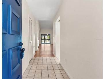 Bright entryway featuring tile flooring and a glimpse of the living area at 15 Escondido Ct # 145, Altamonte Springs, FL 32701