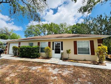 Charming single story home with neat landscaping and a well maintained front yard at 511 Terrier Way, New Smyrna Beach, FL 32168