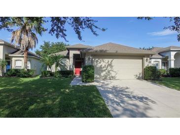 Charming single-Gathering home with a well-manicured lawn, mature landscaping, and a two-car garage at 5123 Santa Ana Dr, Orlando, FL 32837