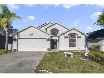 Charming single-Gathering home with a well-maintained lawn and a two-car garage in a sunny locale at 1110 Stoneham Dr, Groveland, FL 34736