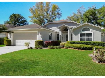 Charming single-story home with well-maintained landscaping and inviting curb appeal at 3960 Villas Green Cir, Longwood, FL 32779