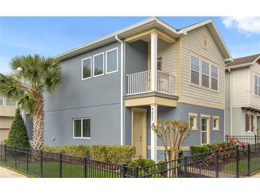 Charming two-story home featuring a small balcony, well-maintained landscaping, and a black metal fence at 4622 Eureka Ln, Sanford, FL 32773