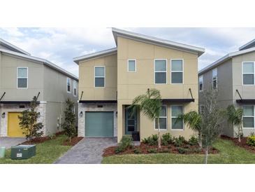 Modern two-story home featuring sleek lines, neutral color palette, and well-maintained landscaping at 9123 Sommerset Hills Dr, Davenport, FL 33896