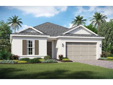 Charming single-story home with lush landscaping, a two-car garage, and a welcoming front entrance at 2168 Seagrass Pt # 424, Kissimmee, FL 34747
