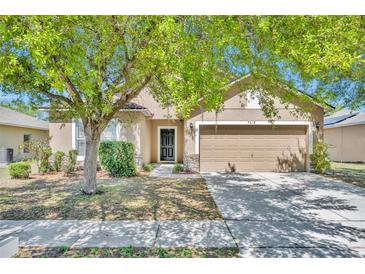 Charming one-story home featuring a two-car garage, neutral colors, and mature landscaping in a desirable neighborhood at 7219 Rafanelli Ct, Orlando, FL 32818