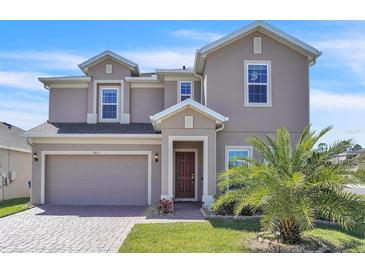 Charming two-story home with a well-maintained front yard and inviting entrance at 9401 La Salle St, Groveland, FL 34736