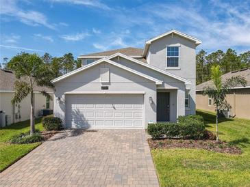 Charming two-story home with a two car garage, paver driveway and a well maintained landscaped yard at 2861 Black Birch Dr, Ocoee, FL 34761