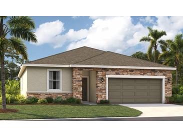 Charming single-story home with a stone-accented facade, two-car garage, and well-manicured lawn at 33336 Seattle Slew Dr, Sorrento, FL 32776