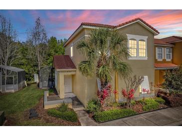 Attractive home exterior with tile roof, colorful plants, and lush landscaping at 4761 Ormond Beach Way, Kissimmee, FL 34746