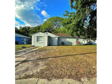 Charming single-story home with a well-maintained lawn, inviting entrance, and mature trees at 613 20Th St, Orlando, FL 32805