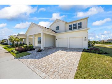 Beautiful two-story home with a spacious two-car garage and a meticulously paved driveway at 15060 Brodie Ln, Winter Garden, FL 34787