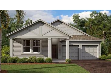 Charming home featuring a two-car garage, landscaped yard, and stylish architectural details at 30162 Rustic Mill St, Mount Dora, FL 32757