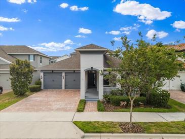 Charming single-Gathering home featuring a brick driveway and manicured landscaping at 778 Gainer Way, Winter Springs, FL 32708