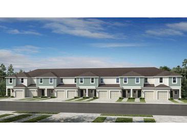 New townhome construction featuring a stylish exterior with modern design elements and well-maintained landscaping at 3550 Mayfair St, Kissimmee, FL 34758