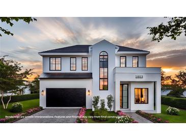 Stunning two-story modern home with a black garage door and manicured lawn at 1803 Florinda Dr, Orlando, FL 32804