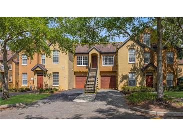 Charming townhome with two-story facade and private garages at 6364 Raleigh St # 1615, Orlando, FL 32835