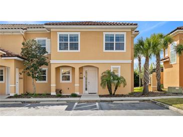 Charming two-story townhome featuring a private entrance, well-kept landscaping, and convenient parking at 2608 Roadster Ln, Kissimmee, FL 34746