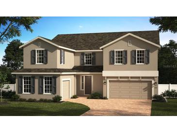 Charming two-story home featuring a manicured lawn, neutral paint, dark shutters, and a two-car garage at 7264 Dilly Lake Ave, Groveland, FL 34736