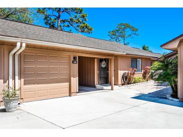 Charming one-story home with attached garage, covered entry and front yard landscaping at 140 Pinesong Dr, Casselberry, FL 32707