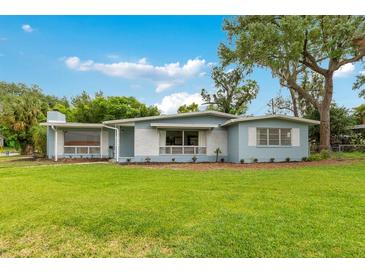 Charming single-story home with a well-manicured lawn and inviting curb appeal at 3107 Troy Dr, Orlando, FL 32806