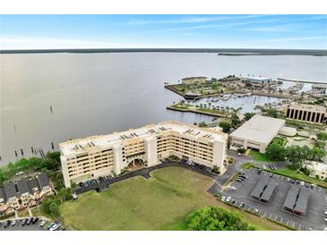 Stunning aerial view of condo building near a scenic waterfront and marina at 225 W Seminole Blvd # 409, Sanford, FL 32771