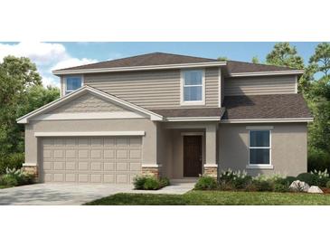 Charming two-story home featuring a stone-accented facade, neutral siding, and a covered entryway at 4747 Cloister St, Kissimmee, FL 34758