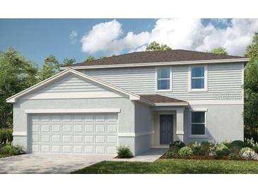 Charming two-story home with a neutral color palette and an attached two-car garage at 4753 Cloister St, Kissimmee, FL 34758