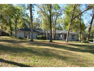 Charming one-story home with a well-maintained lawn and mature trees offering shade and curb appeal at 308 Tangerine St, Altamonte Springs, FL 32701