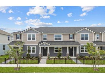 Charming townhomes feature neutral exteriors, well-maintained landscaping, and inviting entrances at 4232 Sadler Rd, Apopka, FL 32712