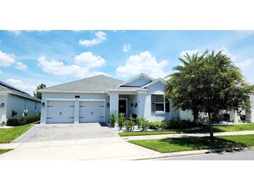 Charming one-story home with a two-car garage, well-manicured lawn, and beautiful curb appeal at 4687 Fairy Tale Cir, Kissimmee, FL 34746