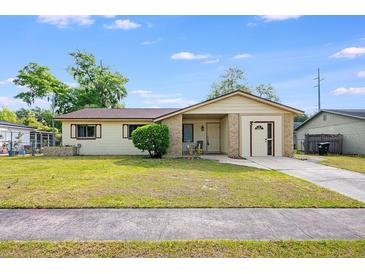 Charming single-story home with well-maintained lawn and front door at 870 Darwin Dr, Altamonte Springs, FL 32701